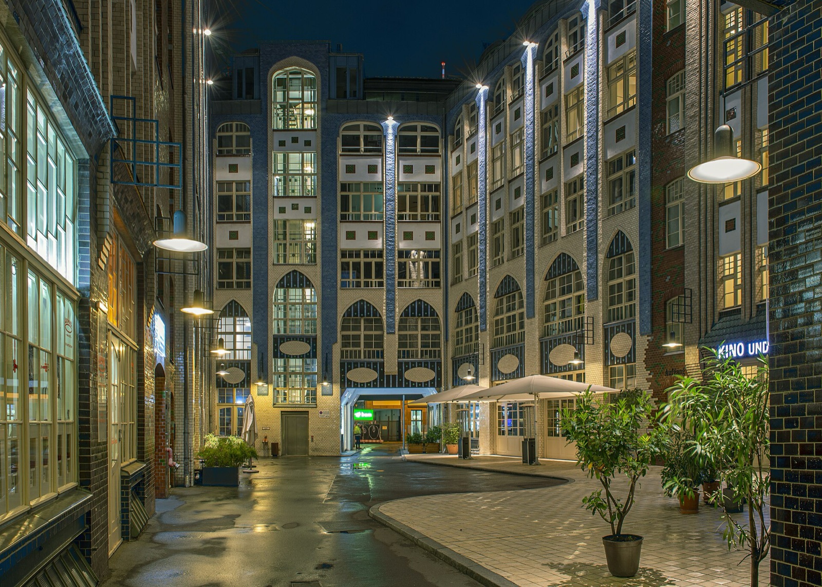 The tiled first courtyard of Hackesche Höfe at night