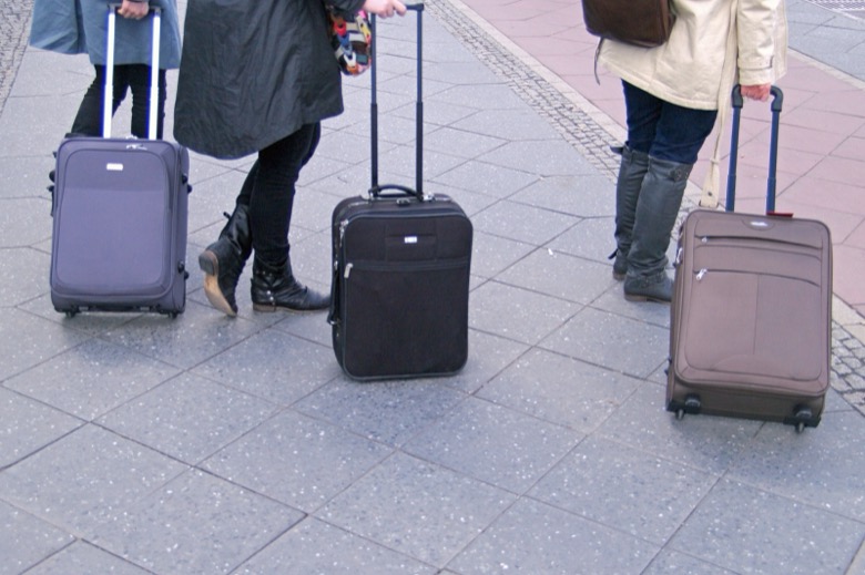 Rolling suitcases at Berlin Hauptbahnhof.