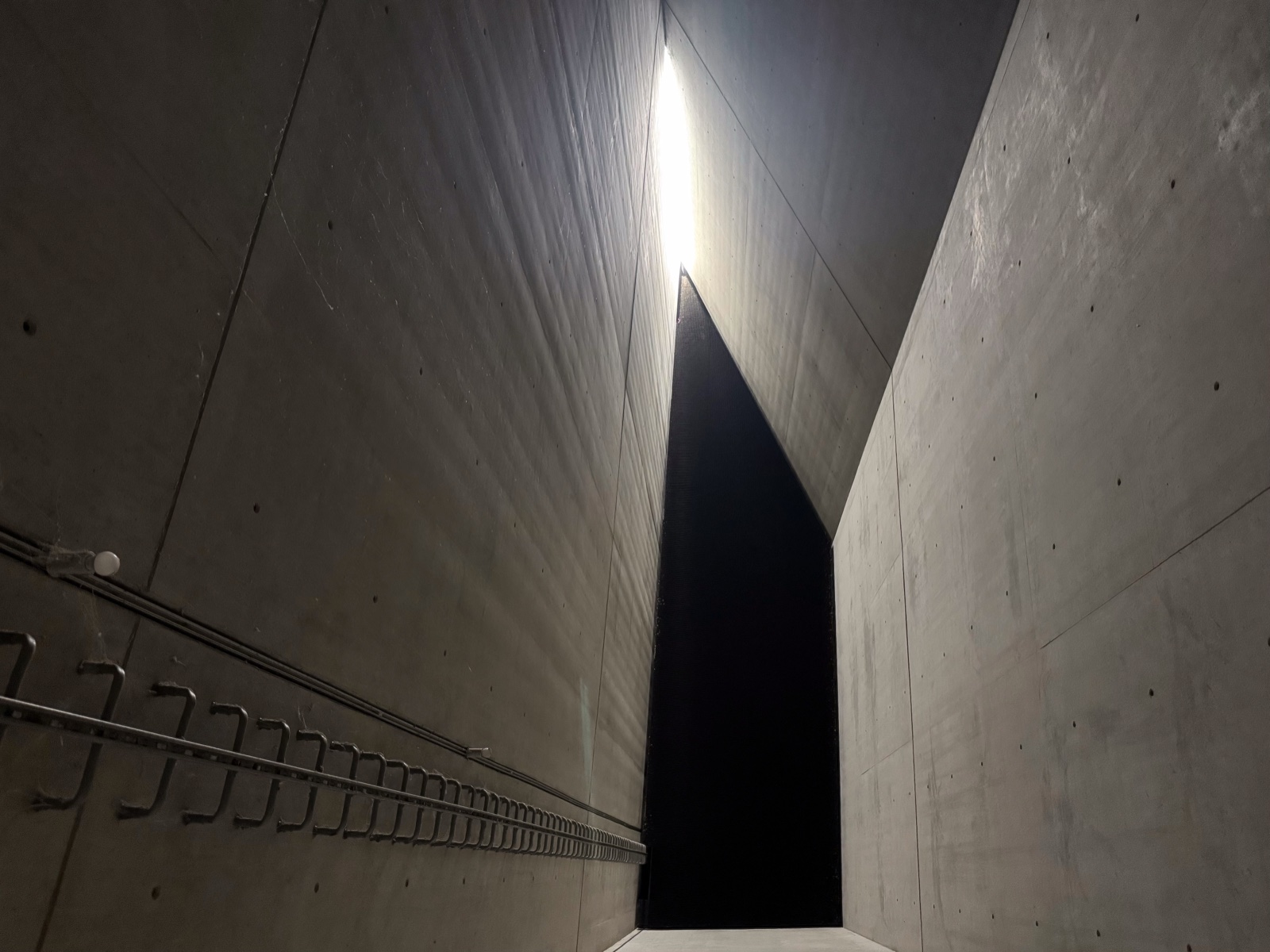 Light entering the high concrete Holocaust Tower at the Jewish Museum Berlin